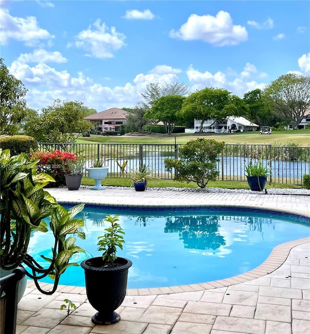 12022 Classic Dr, Coral Springs, FL 33071 - view of pool featuring fence and a water view