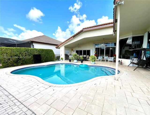 12022 Classic Dr, Coral Springs, FL 33071 - view of swimming pool with a patio