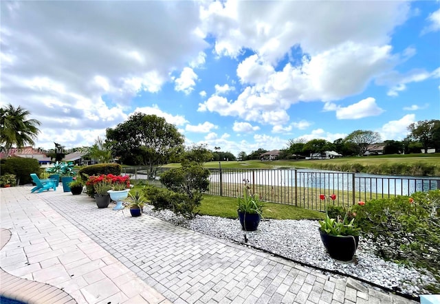 12022 Classic Dr, Coral Springs, FL 33071 - view of patio / terrace with a water view and fence
