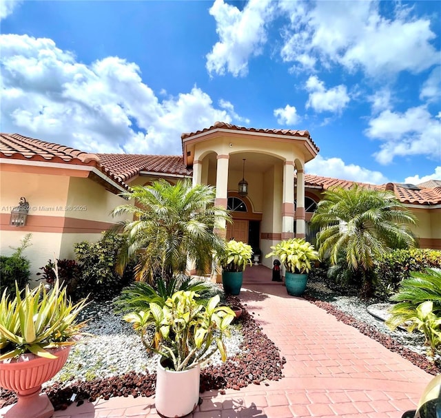 12022 Classic Dr, Coral Springs, FL 33071 - view of front of property with a tiled roof and stucco siding