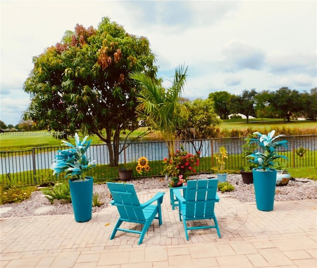 12022 Classic Dr, Coral Springs, FL 33071 - fenced backyard featuring a patio area and a water view
