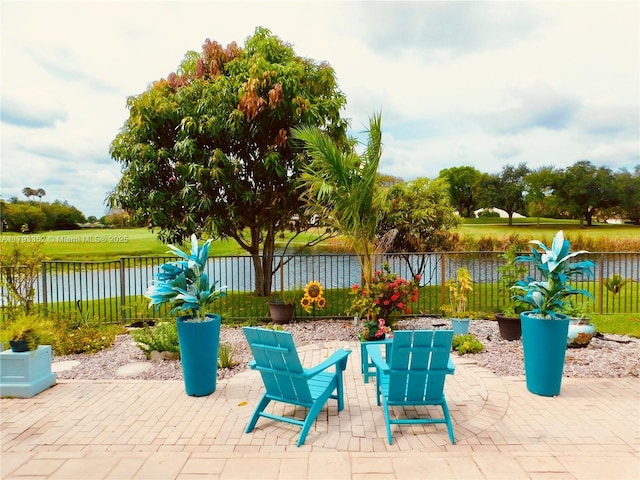 12022 Classic Dr, Coral Springs, FL 33071 - view of patio featuring a water view