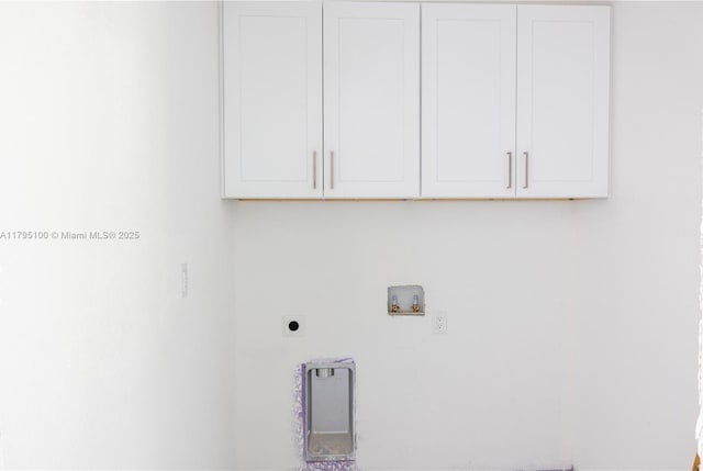 laundry area featuring cabinet space, hookup for an electric dryer, and hookup for a washing machine
