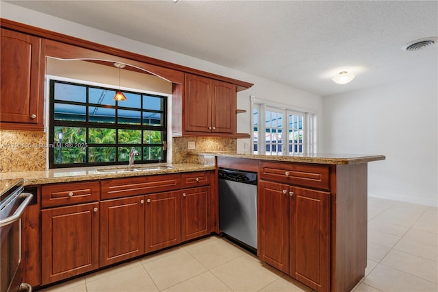 kitchen featuring stainless steel dishwasher, visible vents, a peninsula, a sink, and range