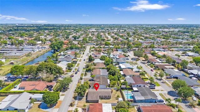 bird's eye view with a water view and a residential view