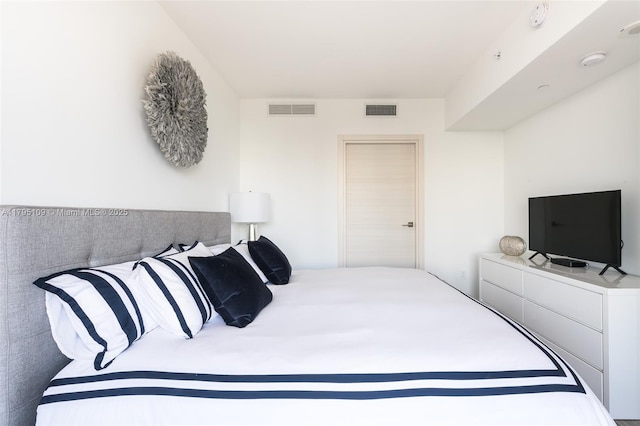 bedroom featuring visible vents