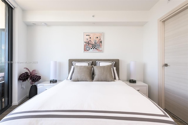 bedroom featuring dark wood finished floors