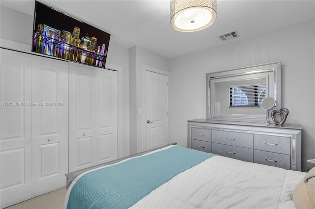 617 W 33rd St, Hialeah, FL 33012 - tiled bedroom with visible vents and a closet