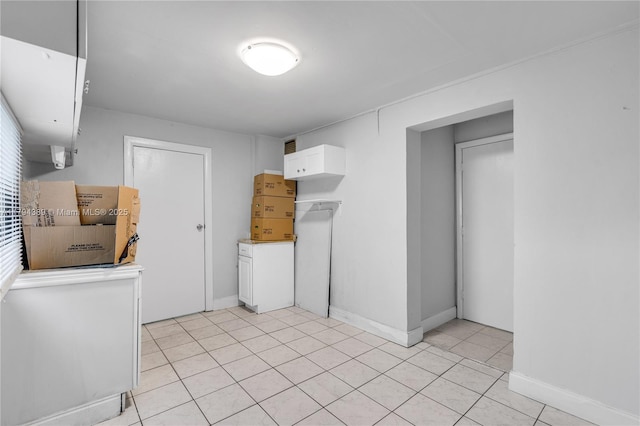 617 W 33rd St, Hialeah, FL 33012 - washroom featuring baseboards and light tile patterned flooring