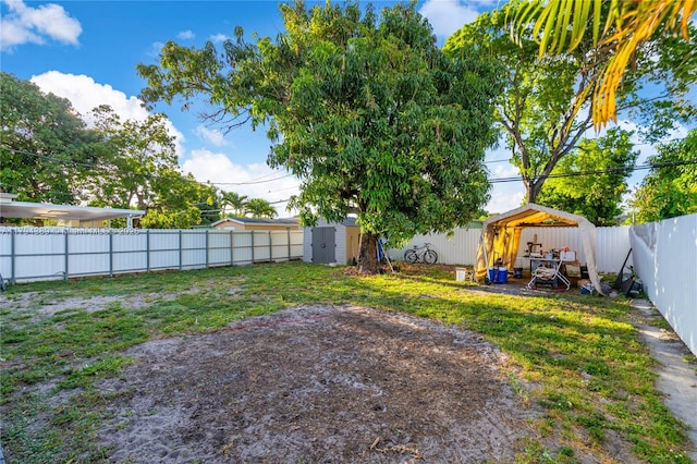 617 W 33rd St, Hialeah, FL 33012 - view of yard with a fenced backyard, a shed, and an outbuilding