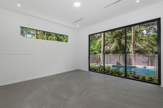 2730 SW 17th Ave, Miami, FL 33133 - spare room with finished concrete flooring, baseboards, and recessed lighting