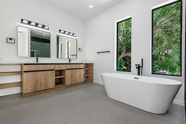 2730 SW 17th Ave, Miami, FL 33133 - bathroom with double vanity, finished concrete flooring, a freestanding tub, walk in shower, and a sink