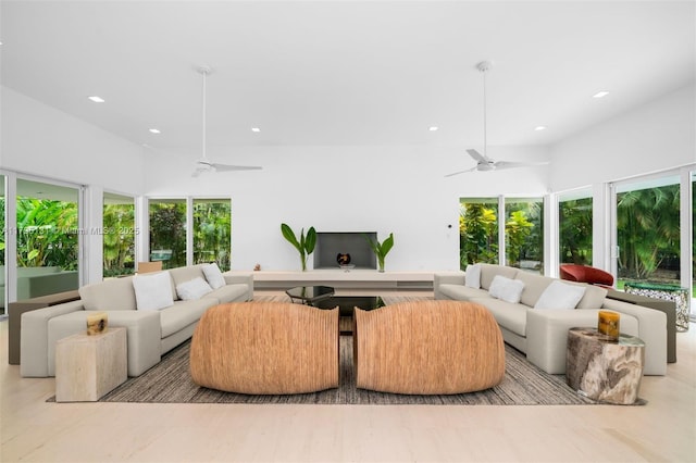 living area featuring recessed lighting and ceiling fan