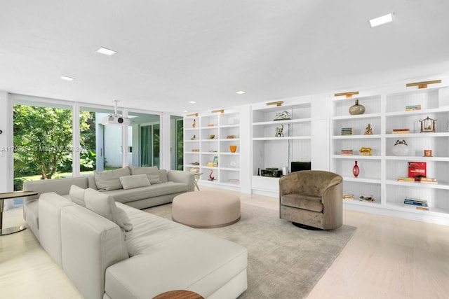 living room with expansive windows and wood finished floors
