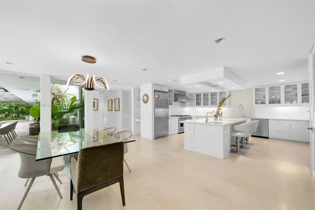 dining room featuring visible vents