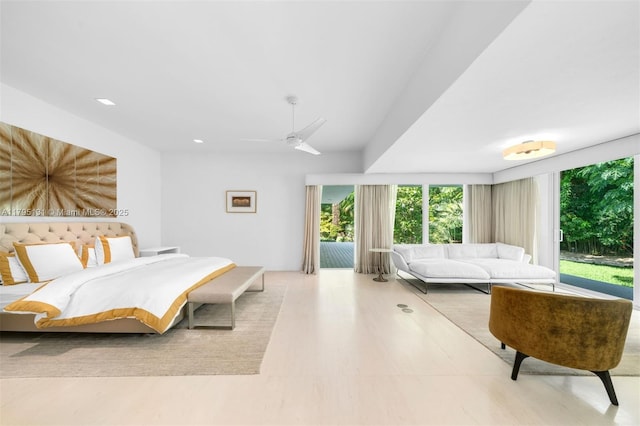 bedroom featuring recessed lighting, ceiling fan, multiple windows, and access to exterior