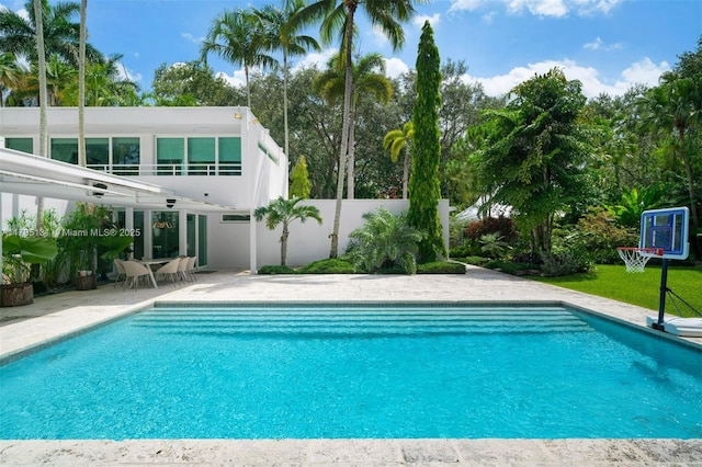 outdoor pool with a patio