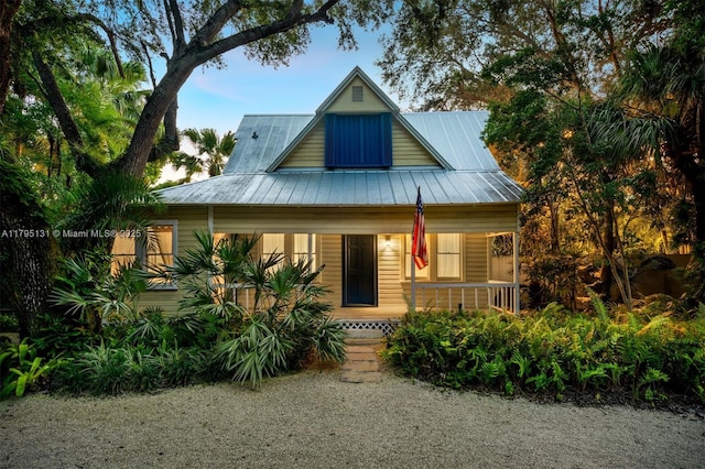 view of front of house featuring a porch and metal roof