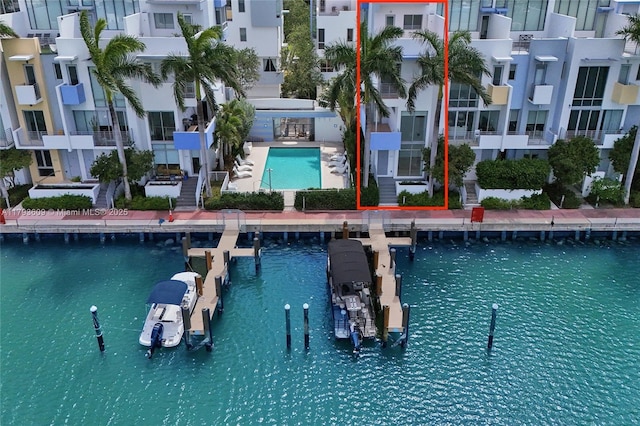 171 N Shore Dr Unit 171-1, Miami Beach, FL 33141 - living area featuring a high ceiling and concrete floors