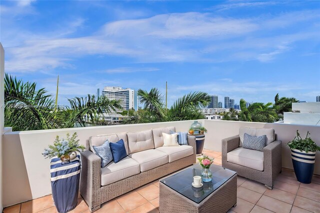 171 N Shore Dr Unit 171-1, Miami Beach, FL 33141 - view of patio with a view of city, outdoor lounge area, and a balcony