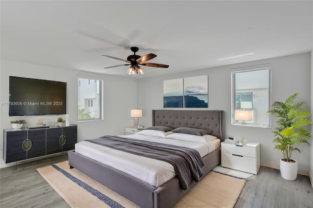 171 N Shore Dr Unit 171-1, Miami Beach, FL 33141 - bedroom with light wood-type flooring, ceiling fan, and baseboards