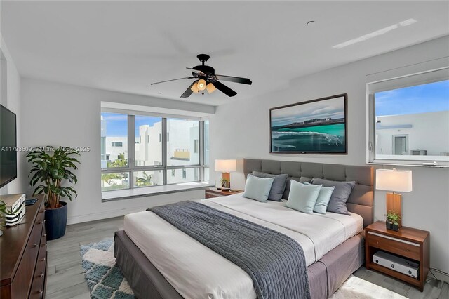 171 N Shore Dr Unit 171-1, Miami Beach, FL 33141 - bedroom with light wood-type flooring, ceiling fan, and baseboards
