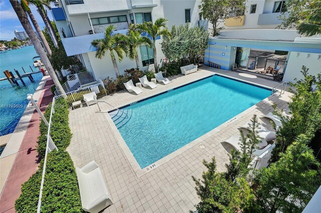 171 N Shore Dr Unit 171-1, Miami Beach, FL 33141 - community pool featuring a water view and a patio area