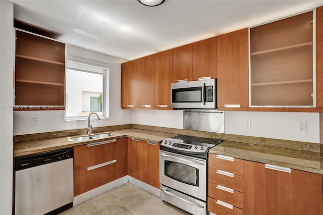 171 N Shore Dr Unit 171-1, Miami Beach, FL 33141 - kitchen featuring brown cabinetry, appliances with stainless steel finishes, modern cabinets, open shelves, and a sink
