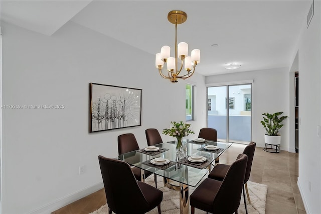 171 N Shore Dr Unit 171-1, Miami Beach, FL 33141 - dining area featuring baseboards, visible vents, and a notable chandelier