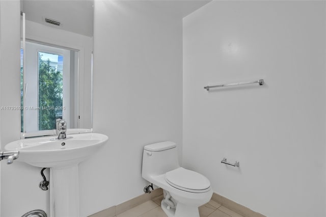 171 N Shore Dr Unit 171-1, Miami Beach, FL 33141 - bathroom featuring visible vents, baseboards, tile patterned floors, and toilet