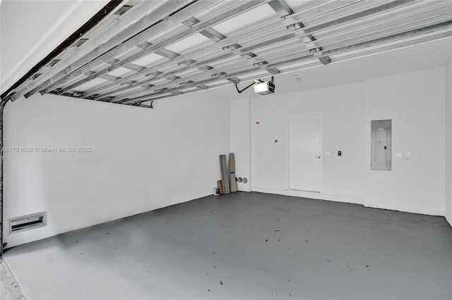 171 N Shore Dr Unit 171-1, Miami Beach, FL 33141 - garage featuring a garage door opener and electric panel