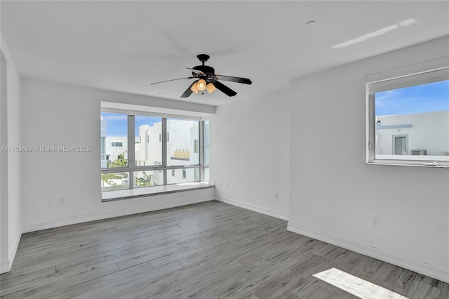 171 N Shore Dr Unit 171-1, Miami Beach, FL 33141 - empty room with baseboards, ceiling fan, and wood finished floors