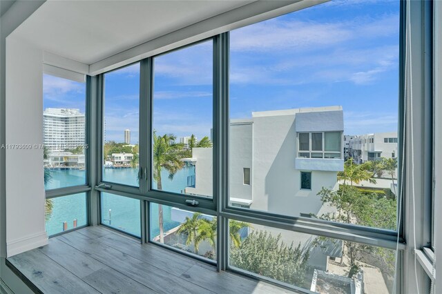 171 N Shore Dr Unit 171-1, Miami Beach, FL 33141 - unfurnished sunroom with a water view