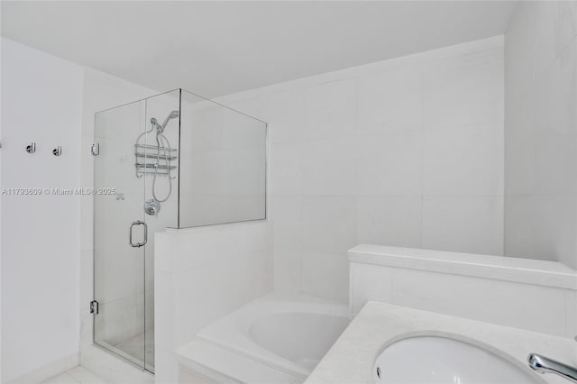 171 N Shore Dr Unit 171-1, Miami Beach, FL 33141 - full bathroom with a sink, a bath, and a stall shower