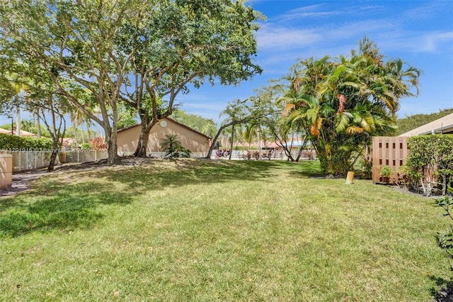 9751 Malvern Dr, Tamarac, FL 33321 - kitchen with high vaulted ceiling, stainless steel appliances, a ceiling fan, a peninsula, and backsplash