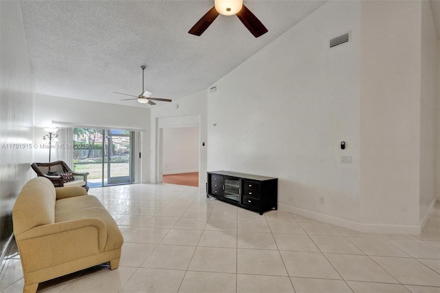 9751 Malvern Dr, Tamarac, FL 33321 - living area featuring visible vents, lofted ceiling, ceiling fan, a textured ceiling, and light tile patterned floors