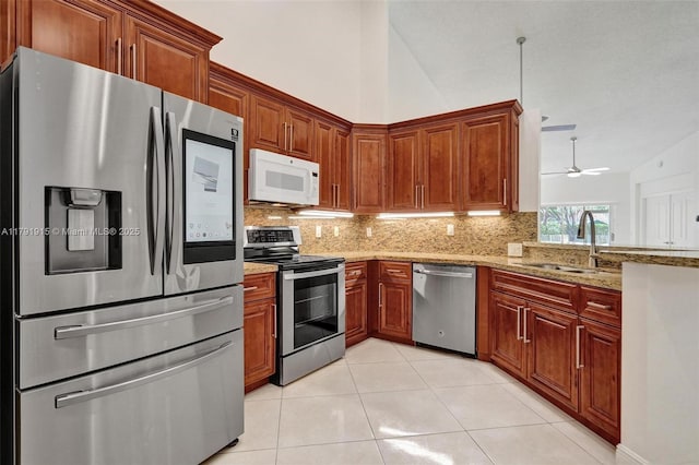 9751 Malvern Dr, Tamarac, FL 33321 - kitchen with a sink, tasteful backsplash, vaulted ceiling, and stainless steel appliances
