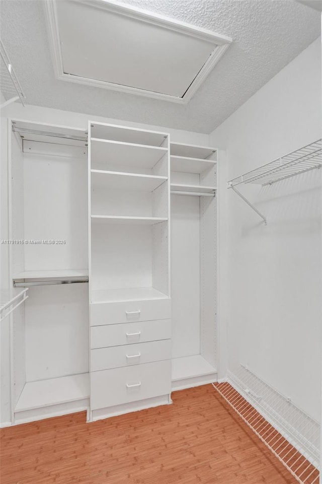 9751 Malvern Dr, Tamarac, FL 33321 - spacious closet with attic access and wood finished floors