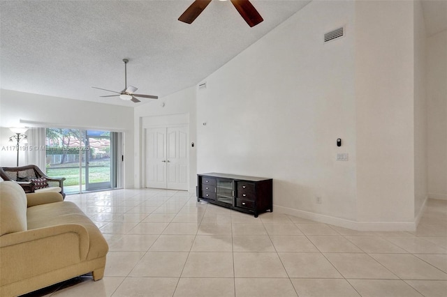 9751 Malvern Dr, Tamarac, FL 33321 - living area featuring visible vents, a ceiling fan, light tile patterned floors, and lofted ceiling