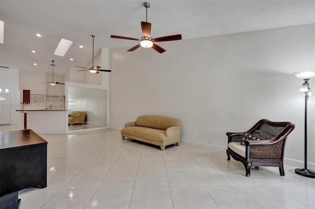 9751 Malvern Dr, Tamarac, FL 33321 - living area featuring a ceiling fan, a skylight, light tile patterned floors, baseboards, and recessed lighting