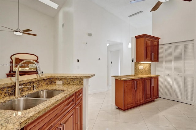 9751 Malvern Dr, Tamarac, FL 33321 - kitchen featuring ceiling fan, tasteful backsplash, a sink, high vaulted ceiling, and light tile patterned floors