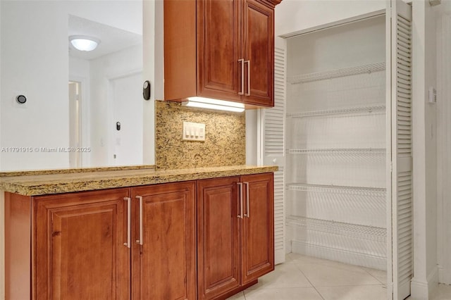 9751 Malvern Dr, Tamarac, FL 33321 - interior space with tasteful backsplash, light stone countertops, and light tile patterned flooring