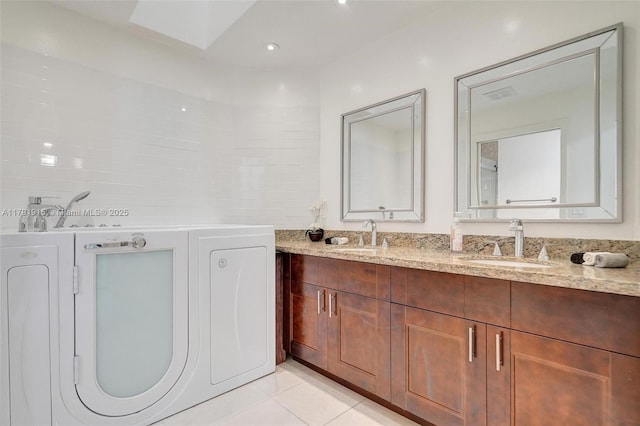 9751 Malvern Dr, Tamarac, FL 33321 - full bathroom featuring tile patterned flooring, washer / clothes dryer, double vanity, and a sink