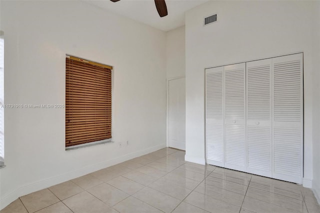9751 Malvern Dr, Tamarac, FL 33321 - unfurnished bedroom featuring a ceiling fan, a closet, visible vents, baseboards, and light tile patterned flooring