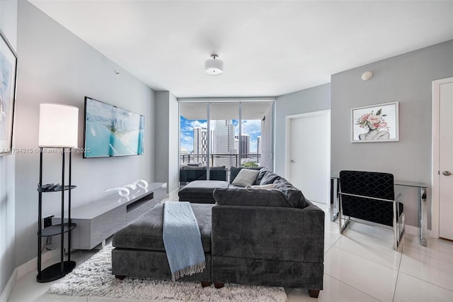 tiled living room with baseboards and expansive windows