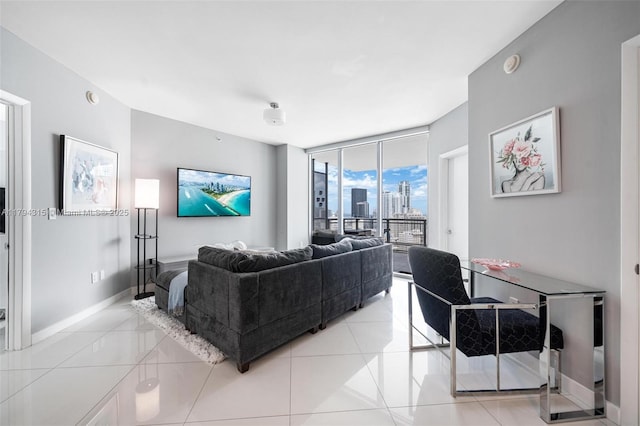 living room with baseboards and a wall of windows