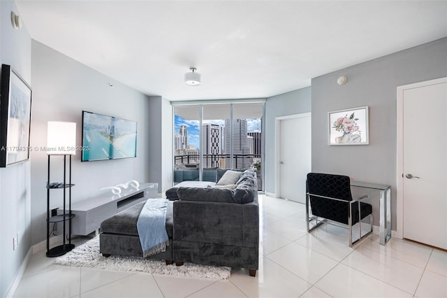 living room featuring light tile patterned flooring and baseboards