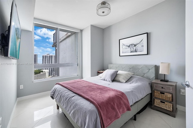tiled bedroom with baseboards