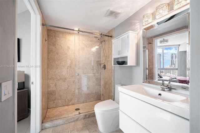 full bath with vanity, a shower stall, toilet, and visible vents