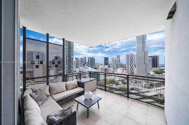 balcony with a view of city and an outdoor living space